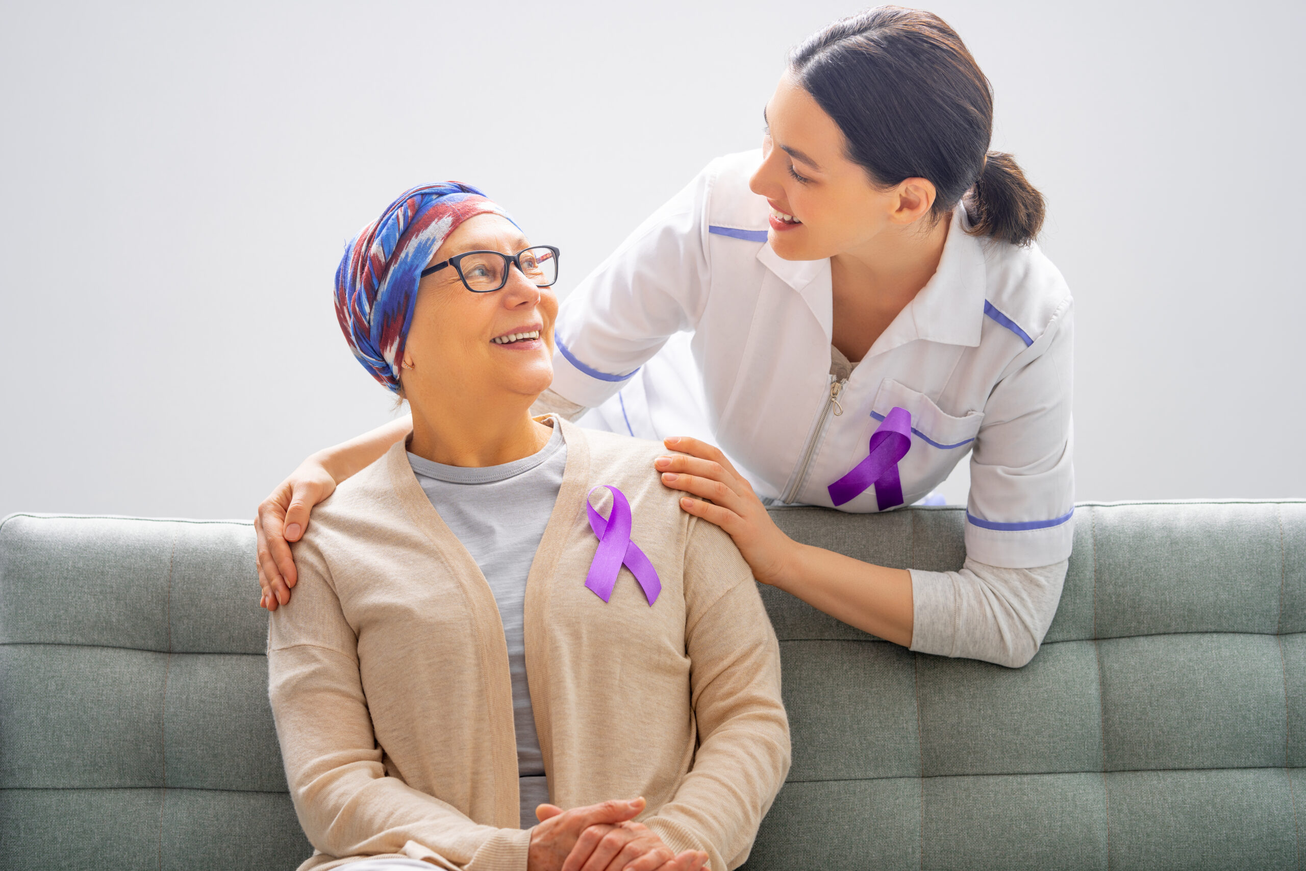 February 4 World Cancer Day. Female patient listening to doctor in medical office. Raising knowledge on people living with tumor illness.