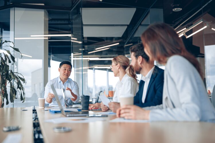 Confident and successful team. Group of people are working together in office. Business concept